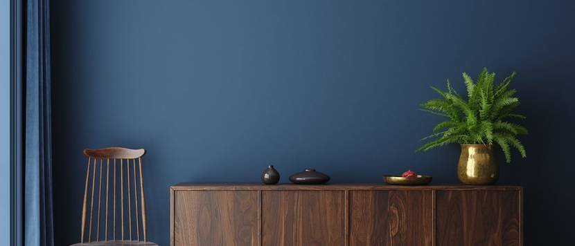 furniture in front of a blue wall